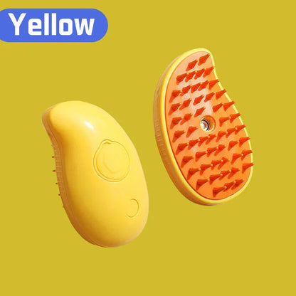 Yellow and orange scalp massager brush with soft bristles on a yellow background.