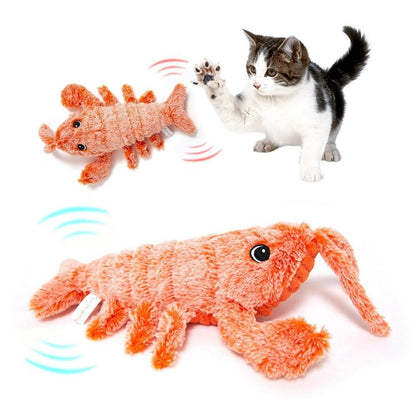 Orange plush lobster-shaped cat toy with sound waves, being pawed by a kitten.